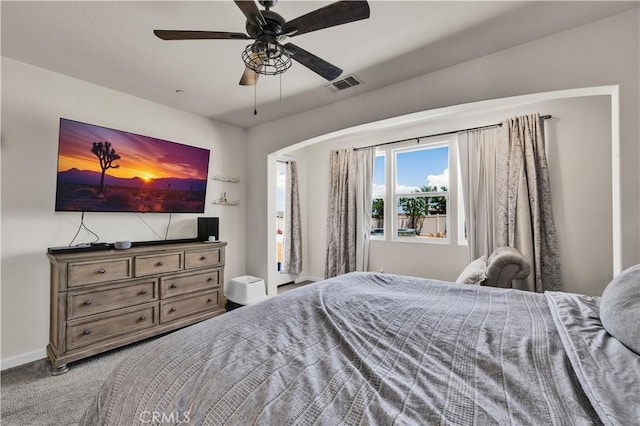 7988 Borrego Ct, Yucca Valley, CA 92284 - carpeted bedroom featuring baseboards, ceiling fan, and arched walkways