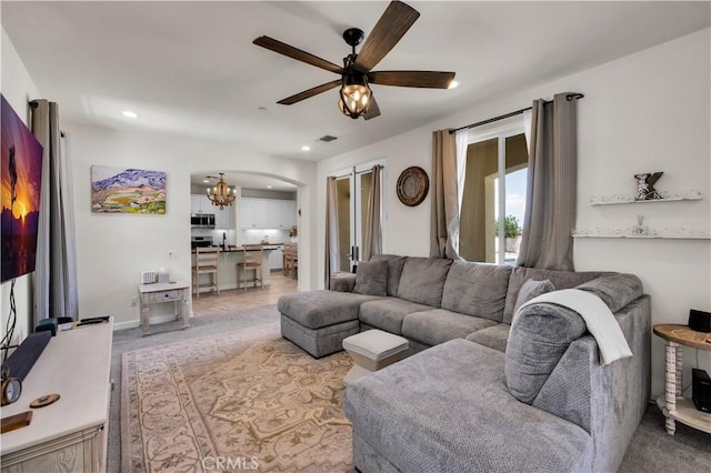 7988 Borrego Ct, Yucca Valley, CA 92284 - living room with a ceiling fan, a chandelier, recessed lighting, and arched walkways