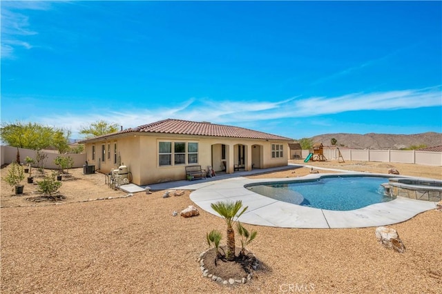 7988 Borrego Ct, Yucca Valley, CA 92284 - view of pool with a fenced backyard, a pool with connected hot tub, cooling unit, and a patio area