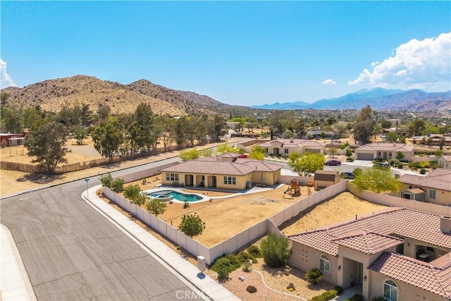 7988 Borrego Ct, Yucca Valley, CA 92284 - aerial perspective of suburban area featuring a mountainous background and a pool area