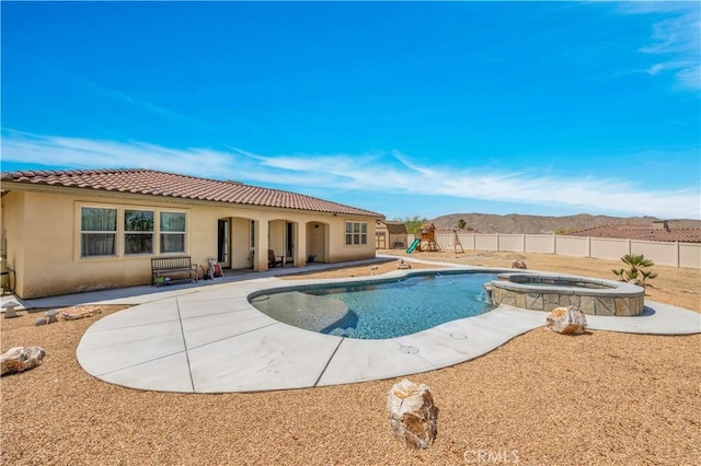 7988 Borrego Ct, Yucca Valley, CA 92284 - view of swimming pool featuring a fenced backyard, a patio, and a pool with connected hot tub
