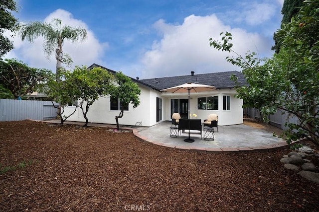 11217 Stonecress Ave, Fountain Valley, CA 92708 - back of property with stucco siding, a patio area, and roof with shingles