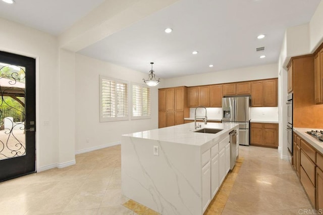 2413 Paseo, Los Gatos, Chula Vista, CA 91914 - kitchen with appliances with stainless steel finishes, brown cabinetry, recessed lighting, light tile patterned floors, and an island with sink