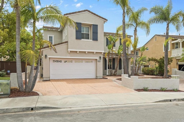 2413 Paseo, Los Gatos, Chula Vista, CA 91914 - view of front of house featuring stucco siding, decorative driveway, an attached garage, and a tiled roof