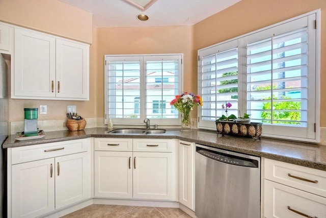 3376 Corsica Way, Oceanside, CA 92056 - kitchen featuring dishwasher, white cabinets, a sink, dark stone counters, and light tile patterned floors