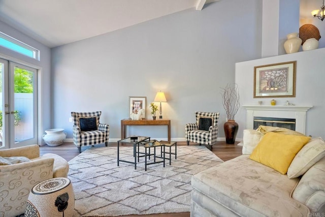 3376 Corsica Way, Oceanside, CA 92056 - living room with a glass covered fireplace, wood finished floors, baseboards, and vaulted ceiling