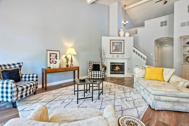 3376 Corsica Way, Oceanside, CA 92056 - living room with high vaulted ceiling, wood finished floors, a chandelier, beam ceiling, and baseboards