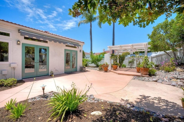 3376 Corsica Way, Oceanside, CA 92056 - back of house featuring french doors, stucco siding, a pergola, a fenced backyard, and a patio area