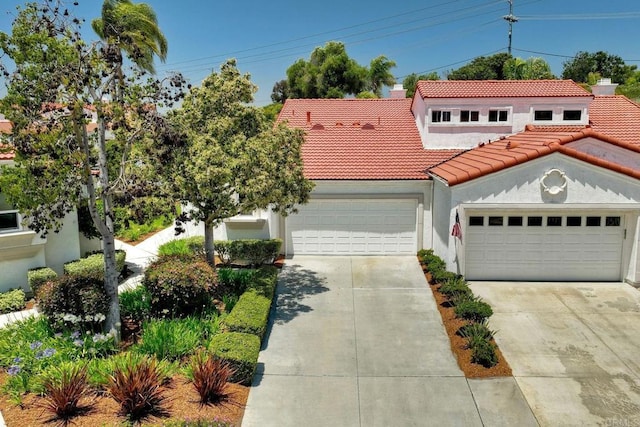 3376 Corsica Way, Oceanside, CA 92056 - mediterranean / spanish-style house featuring a tile roof, driveway, a garage, and stucco siding