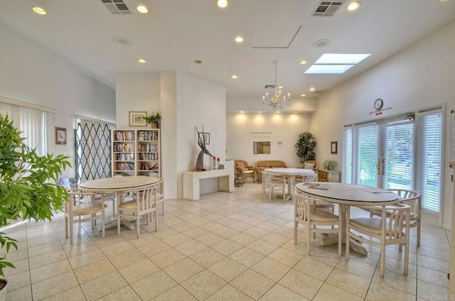 3376 Corsica Way, Oceanside, CA 92056 - dining area with a skylight, a chandelier, recessed lighting, light tile patterned floors, and a high ceiling