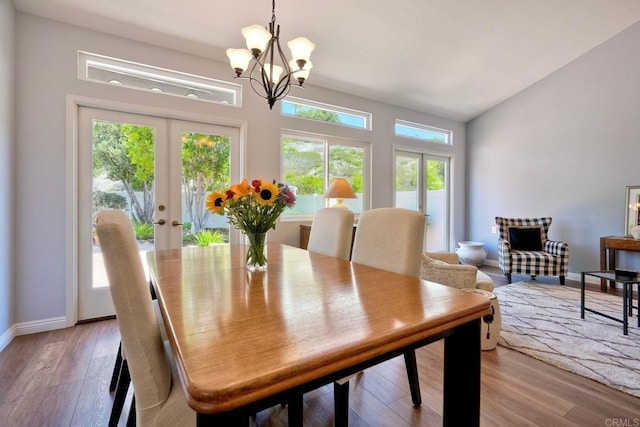 3376 Corsica Way, Oceanside, CA 92056 - dining area featuring french doors, a chandelier, light wood-type flooring, and lofted ceiling