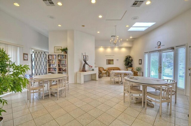 3376 Corsica Way, Oceanside, CA 92056 - dining space featuring a skylight, a chandelier, recessed lighting, light tile patterned flooring, and a towering ceiling