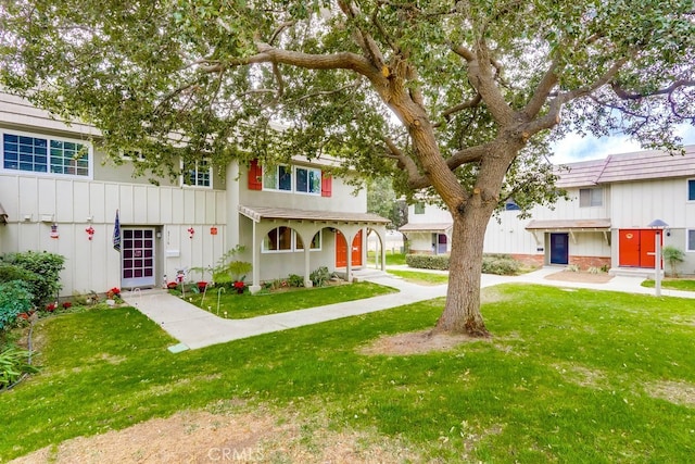 4714 Larwin Ave, Cypress, CA 90630 - townhome / multi-family property featuring a front yard and board and batten siding