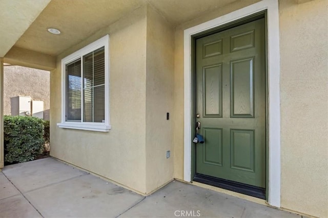 21567 Coral Rock Ln, Wildomar, CA 92595 - property entrance featuring stucco siding