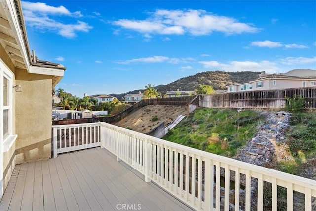 21567 Coral Rock Ln, Wildomar, CA 92595 - wooden terrace with a mountain view, a residential view, and a fenced backyard