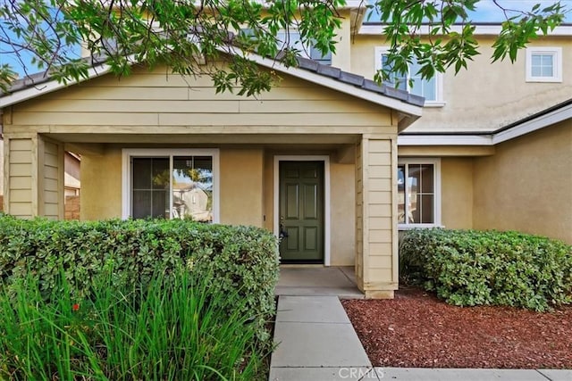 21567 Coral Rock Ln, Wildomar, CA 92595 - doorway to property featuring stucco siding