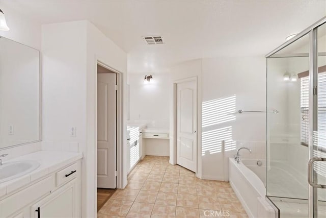 21567 Coral Rock Ln, Wildomar, CA 92595 - bathroom with vanity, a bath, and tile patterned floors