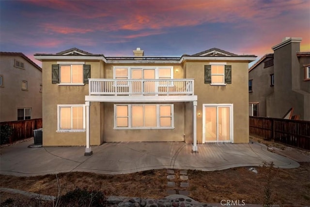 21567 Coral Rock Ln, Wildomar, CA 92595 - rear view of property featuring a balcony, a patio area, stucco siding, and a fenced backyard