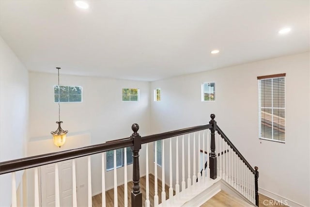 21567 Coral Rock Ln, Wildomar, CA 92595 - corridor featuring recessed lighting, light wood-style flooring, an upstairs landing, and baseboards