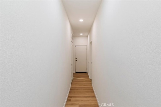 21567 Coral Rock Ln, Wildomar, CA 92595 - corridor featuring recessed lighting, light wood-style flooring, and baseboards