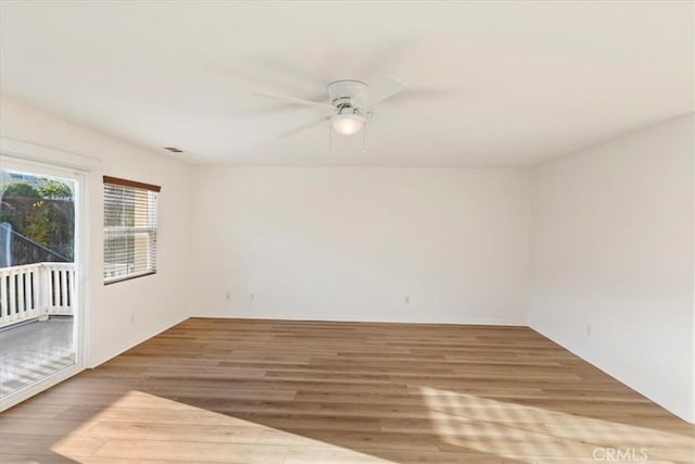 21567 Coral Rock Ln, Wildomar, CA 92595 - empty room with wood finished floors and ceiling fan