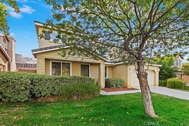 21567 Coral Rock Ln, Wildomar, CA 92595 - view of front of home with concrete driveway, a garage, a front lawn, and stucco siding