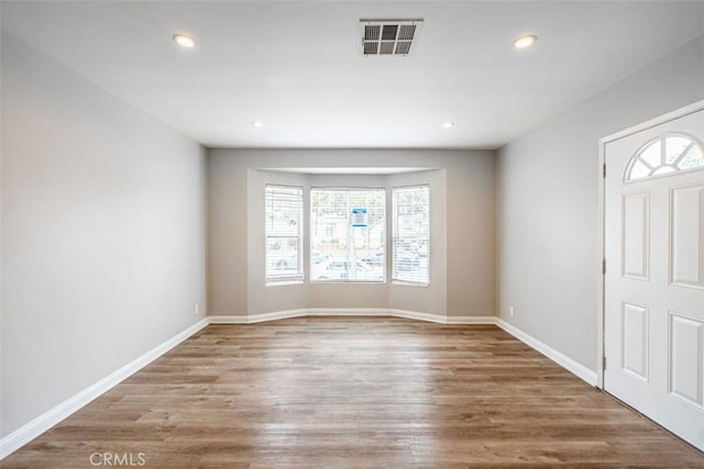 10113 Harvest Ave, Santa Fe Springs, CA 90670 - entrance foyer with plenty of natural light, wood finished floors, recessed lighting, and baseboards