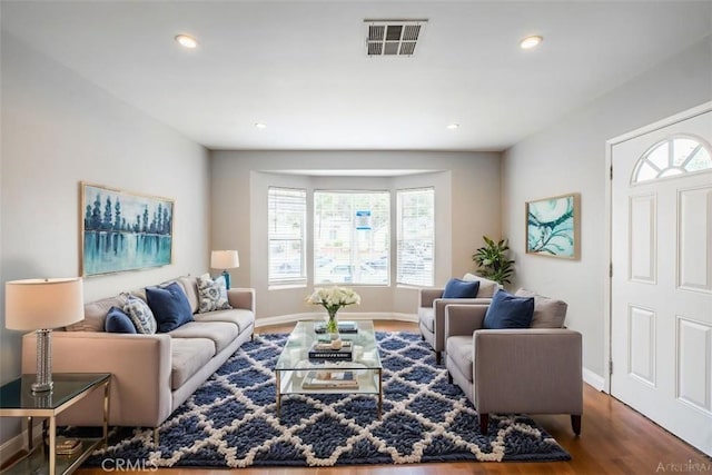 10113 Harvest Ave, Santa Fe Springs, CA 90670 - living area featuring wood finished floors, baseboards, and recessed lighting