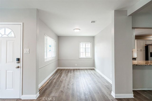 10113 Harvest Ave, Santa Fe Springs, CA 90670 - entryway featuring wood finished floors and baseboards