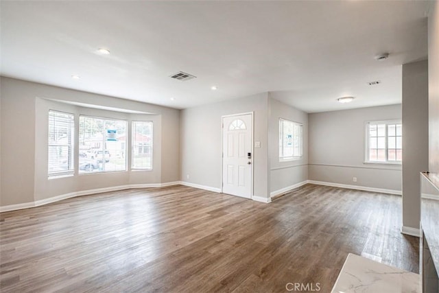 10113 Harvest Ave, Santa Fe Springs, CA 90670 - foyer entrance with healthy amount of natural light, wood finished floors, baseboards, and recessed lighting