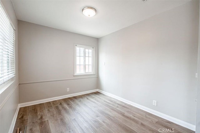 10113 Harvest Ave, Santa Fe Springs, CA 90670 - unfurnished room with wood finished floors and baseboards