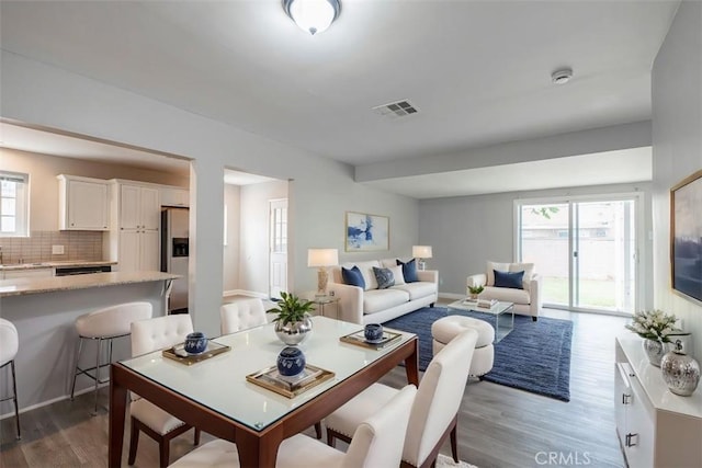 10113 Harvest Ave, Santa Fe Springs, CA 90670 - dining area with wood finished floors