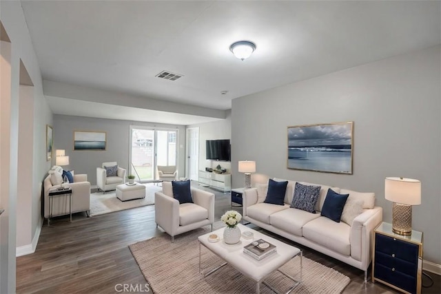10113 Harvest Ave, Santa Fe Springs, CA 90670 - living room featuring wood finished floors and baseboards