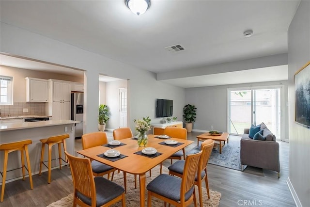 10113 Harvest Ave, Santa Fe Springs, CA 90670 - dining area with wood finished floors and baseboards