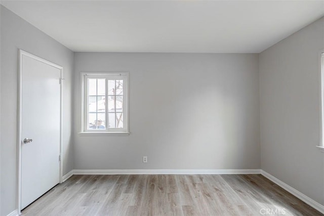 10113 Harvest Ave, Santa Fe Springs, CA 90670 - spare room with light wood-style flooring and baseboards