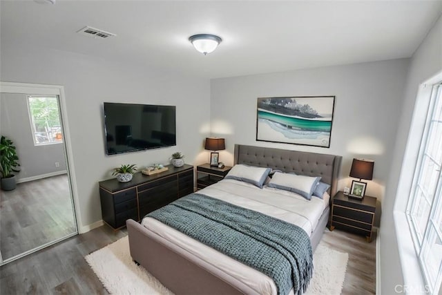 10113 Harvest Ave, Santa Fe Springs, CA 90670 - bedroom featuring wood finished floors and baseboards