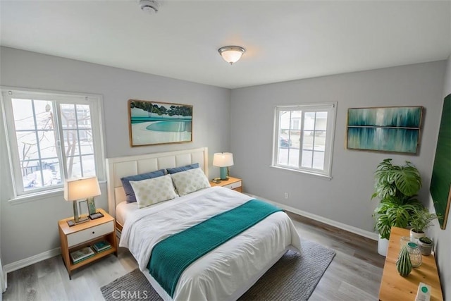 10113 Harvest Ave, Santa Fe Springs, CA 90670 - bedroom with baseboards and wood finished floors