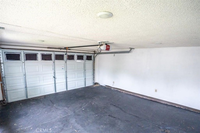 10113 Harvest Ave, Santa Fe Springs, CA 90670 - garage with a garage door opener and baseboards