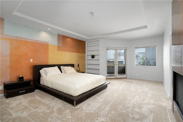 12841 Bloomfield St Unit 103, Studio City, CA 91604 - bedroom featuring a raised ceiling, access to outside, carpet floors, and baseboards