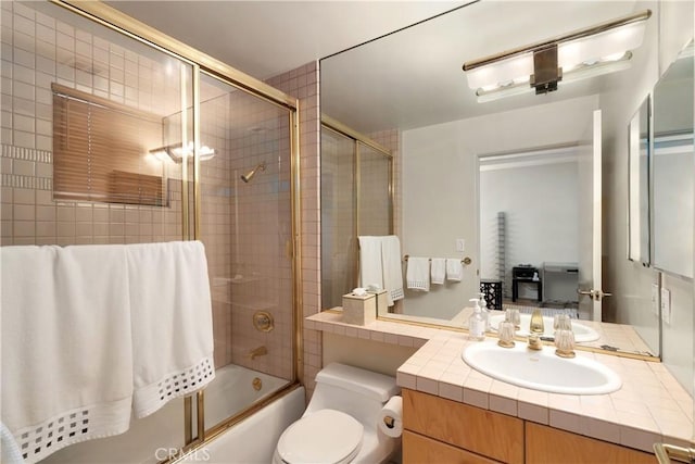 12841 Bloomfield St Unit 103, Studio City, CA 91604 - bathroom featuring shower / bath combination with glass door, vanity, and toilet