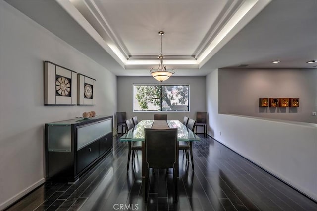 12841 Bloomfield St Unit 103, Studio City, CA 91604 - dining area featuring a tray ceiling, dark wood-style flooring, baseboards, and recessed lighting