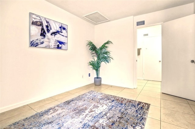 27142 Langside Ave, Canyon Country, CA 91351 - spare room with light tile patterned floors and attic access
