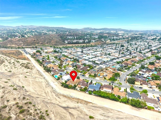 27142 Langside Ave, Canyon Country, CA 91351 - aerial overview of property's location with a mountainous background and nearby suburban area
