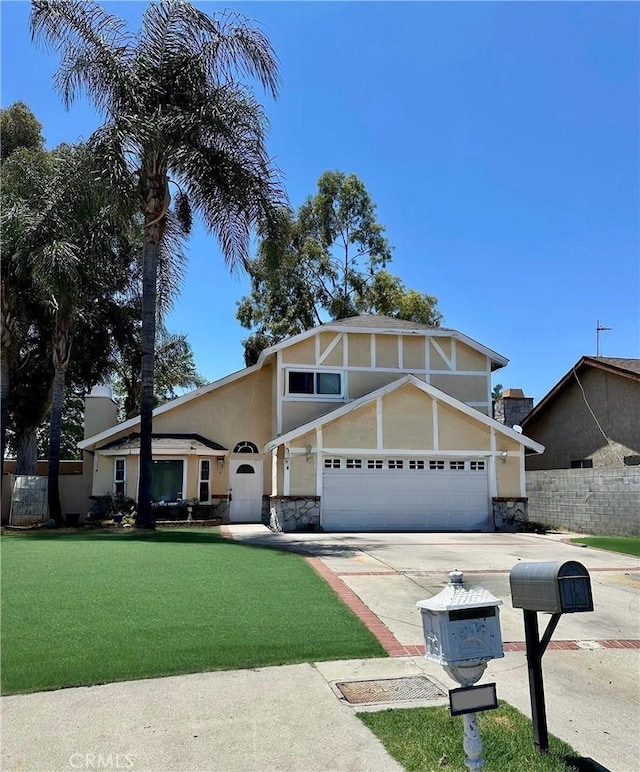 8359 Deering Ave, Canoga Park, CA 91304 - view of front of property featuring driveway, stucco siding, an attached garage, and stone siding
