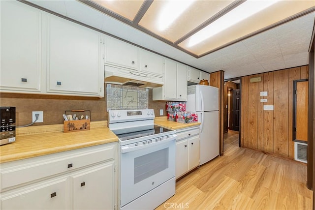 58632 Rainbow Dr, North Fork, CA 93643 - kitchen with white appliances, under cabinet range hood, light countertops, light wood finished floors, and white cabinetry