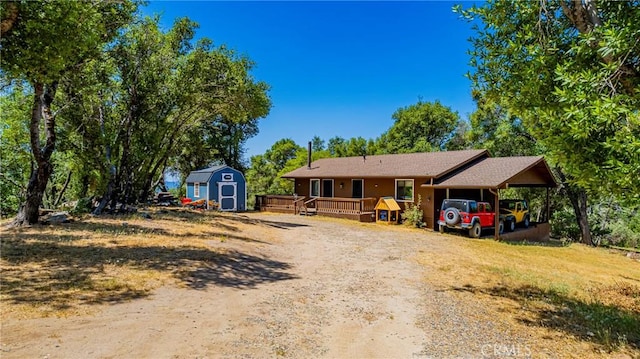 58632 Rainbow Dr, North Fork, CA 93643 - view of front of property with a deck and dirt driveway