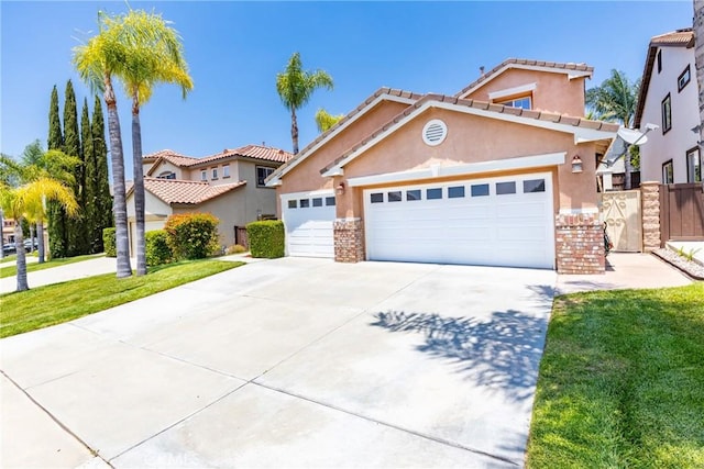 33010 Poppy St, Temecula, CA 92592 - mediterranean / spanish-style home featuring stucco siding, driveway, a garage, and a tiled roof