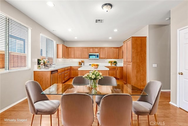 33010 Poppy St, Temecula, CA 92592 - kitchen with appliances with stainless steel finishes, a kitchen island, light countertops, recessed lighting, and baseboards