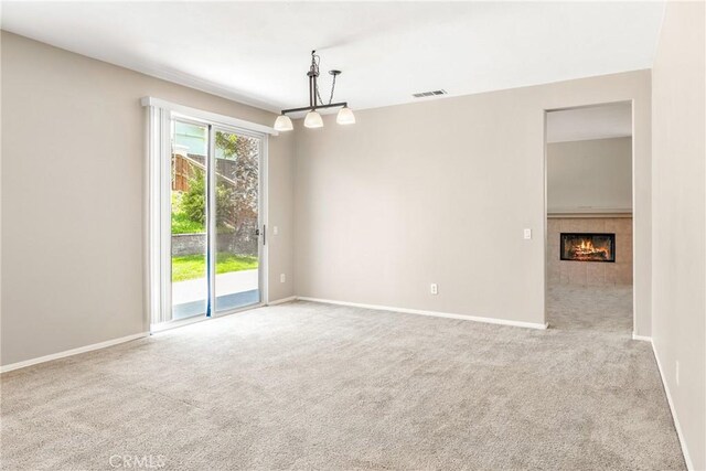 33010 Poppy St, Temecula, CA 92592 - empty room featuring carpet, baseboards, and a tile fireplace