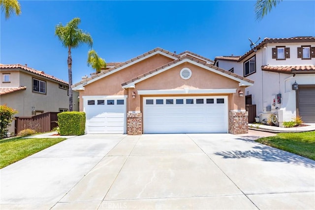 33010 Poppy St, Temecula, CA 92592 - mediterranean / spanish-style house featuring stucco siding, a garage, driveway, and brick siding